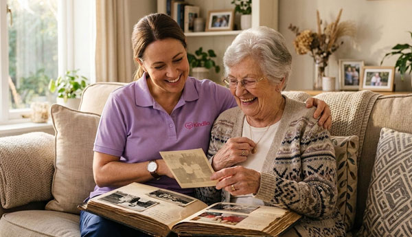 Carer sharing a calm, familiar moment with a client living with dementia at home — dementia care guide.